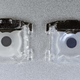 The previous generation of MacBook Pro keys (left) has a foggy silicone membrane, while the new generation (right) has a smooth, transparent membrane.